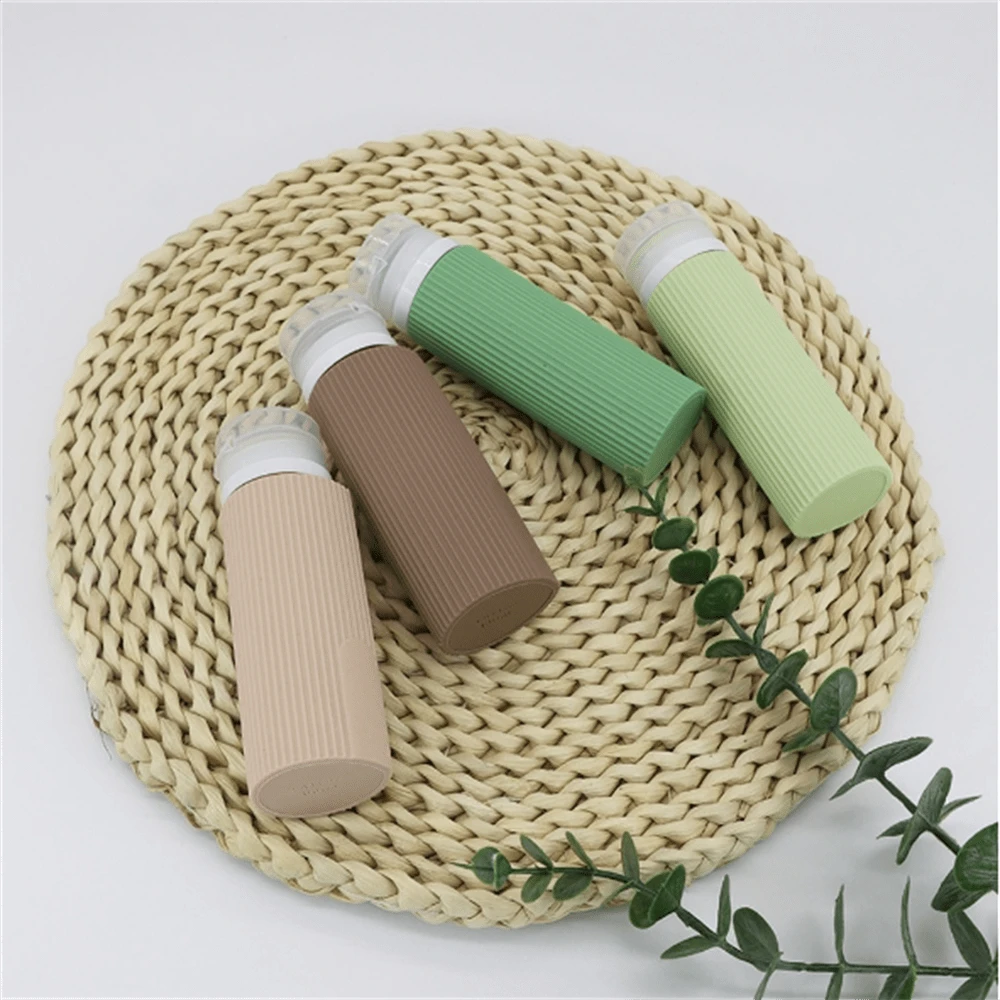 4入組100ml矽膠分裝瓶套裝,適用於護膚品、化妝品、洗髮水、沐浴露、洗衣液罐、便攜旅行瓶