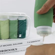 4入組100ml矽膠分裝瓶套裝,適用於護膚品、化妝品、洗髮水、沐浴露、洗衣液罐、便攜旅行瓶