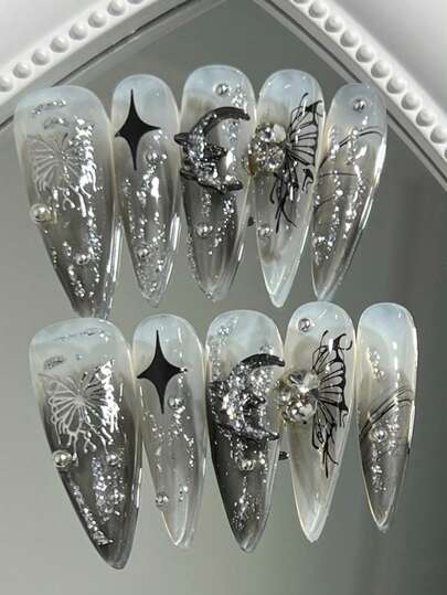 10片长款尖头纯手工制作美甲贴片，黑灰渐变色，液态质感，镂空蝴蝶图案，精细闪粉，金属星月装饰，水晶水钻点缀，全覆盖美甲贴片。适合派对、舞蹈、四季皆宜、日常佩戴、学生、上班族、角色扮演等场合。按压式，可重复使用，附赠1片果冻胶和1个指甲锉。按压式美甲贴片，美甲用品，手工按压式美甲贴片。