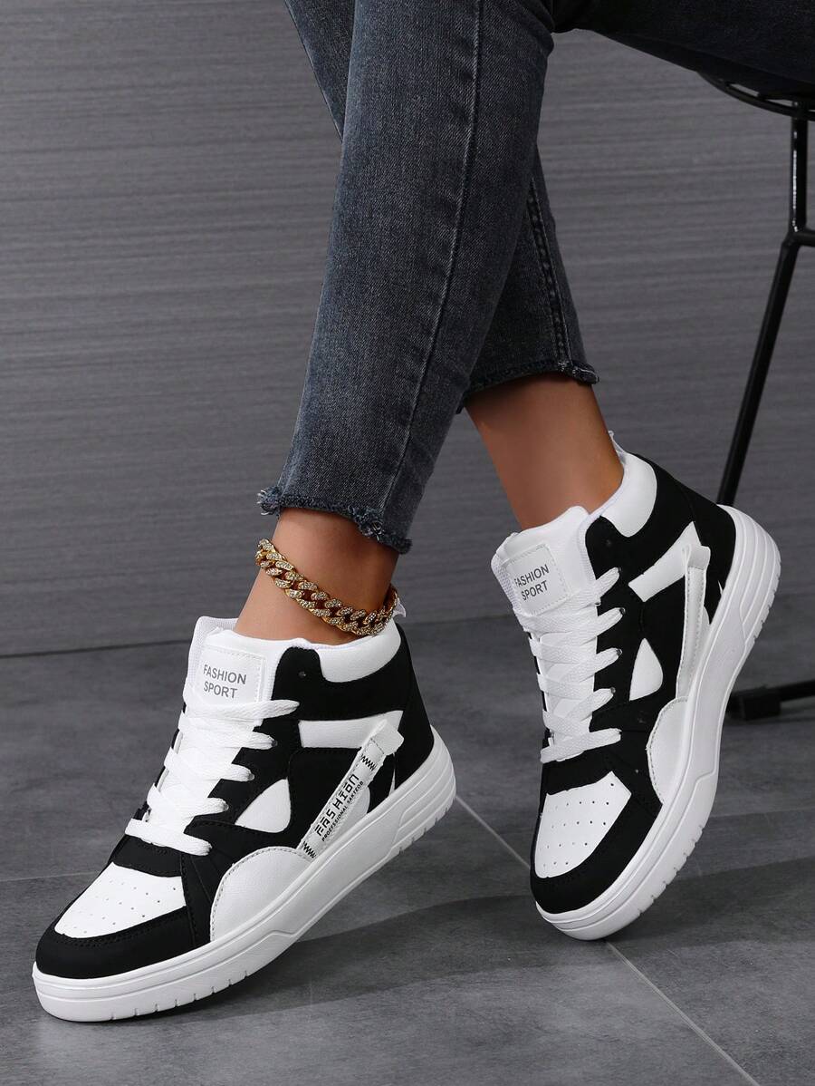 女款黑白休閒高筒運動鞋,秋冬季舒適透氣設計,綁帶式閉合