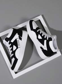 女款黑白休閒高筒運動鞋,秋冬季舒適透氣設計,綁帶式閉合