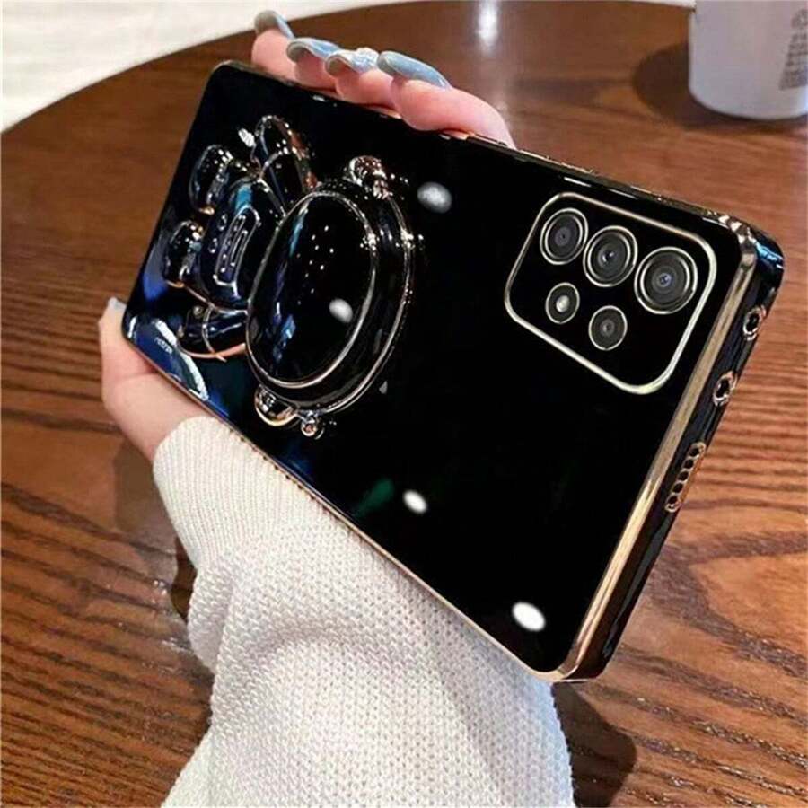 Funda de teléfono con soporte de astronauta de Apple, funda protectora plegable con recubrimiento electrolítico y resistente a golpes, compatible con Samsung A02/M02 A02S A03 A03S A04 A04S A04E A11, versión internacional, no la versión nacional - Borde recto galvanizado negro + soporte astronauta - Ver 1