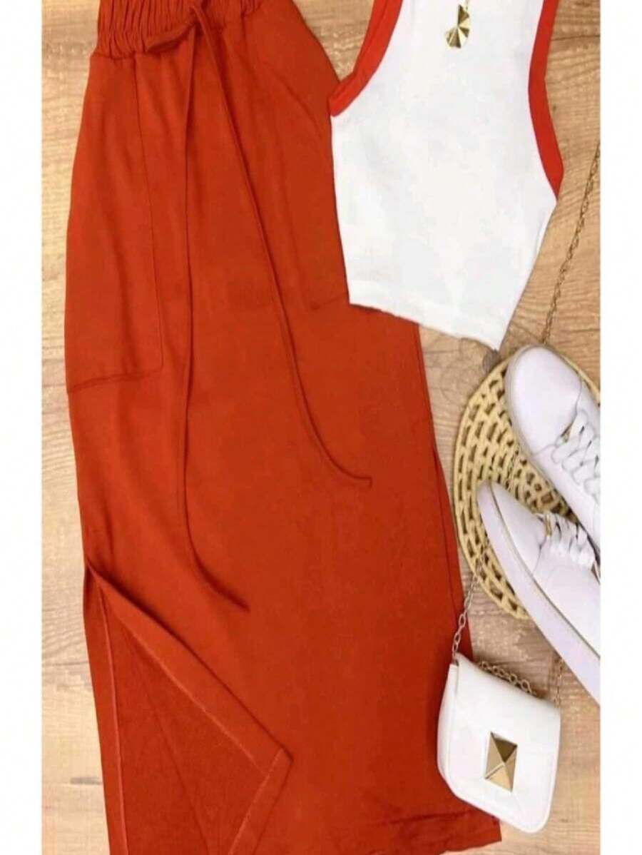 高腰中長裙套裝,帶開岔,與ribana短衣共用,為您帶來時尚感。 - 亮橙色 - 查看 1