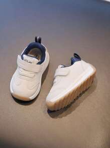 1雙男女通用白色時尚多功能運動鞋，適用於各季兒童