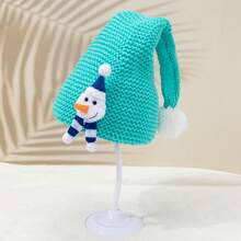1個中性聖誕雪人娃娃裝飾綠色針織帽,設計可愛,適用於聖誕節或冬季穿搭,並作為兒童節日的溫暖禮物
