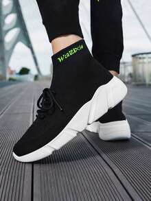 男士針織輕量級減震透氣跑鞋,高彈性舒適的襪套式運動鞋 - 黑與白 - 查看 1