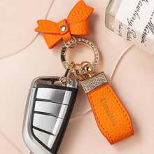 1 pieza Llavero con lazo, colgante de llavero elegante y creativo para mujeres, adecuado para llaves de coche, mochilas - Negro - Ver 6