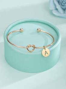 1個時尚優雅的不鏽鋼鍍金26字母切割項鍊,切割心形結環手鐲與首字母,適合當作女友的禮物,在浪漫驚喜上大显身手 - 金色 - 查看 5