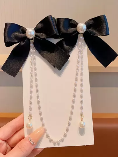 1pc Girls Fashionable Cute Pearl Bow & Tassel Hair Clip. Please Note That Due To Different Batches Of Materials, There May Be Slight Color Difference, And The Packaging Card And The Actual Item Should Prevail. The Number Of Pearls Is Random.