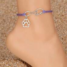 無限符號狗貓爪形吊墜編織踝鍊防水PU皮革腳鐐，可調整大小，寵物愛好者的踝鍊。無限符號踝鍊，編織PU皮革踝鍊，可調節爪印踝鍊，防水寵物踝鍊，動物愛好者珠寶寵物紀念踝鍊，獨特無限符號吊墜踝鍊，別致的編織踝鍊設計時尚的寵物主題珠寶。 - 紫羅蘭色 - 查看 1