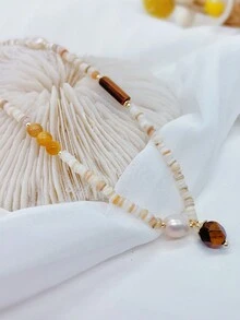 女士珍珠項鏈,珠寶中的理想禮物,時尚飾品,精湛工藝,時尚單品,女神必備,細緻的質感,個性化時尚珠寶,簡約時尚,多用途,修身,優雅,時尚且複雜的時尚元素,適合女性的日常穿著,女士宴會,派對,高貴和優雅,時尚配飾,利基設計,復古而精緻,萬用,輕奢,簡約主義風格。 - 彩色 - 查看 5