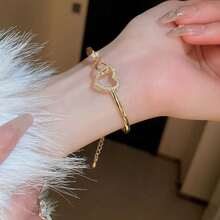 1只鑲有水晶的“愛心”開口手環,求婚禮物婚禮派對用的空心愛心手環,女式珠寶飾品 - 金色 - 查看 1