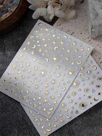 2張波西米亞風格指甲藝術貼紙，包含星星、月亮、紋理和心型圖案，DIY裝飾