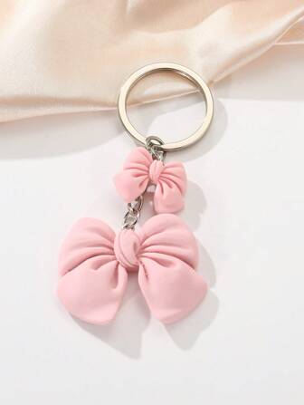 Elegant 1st kreativ fashionabel rosa rosettnyckelring med minimalistiskt polyresinhänge, lämplig för alla hjärtans dag, flickvänspresent och väns födelsedagspresent alla hjärtans dag biltillbehör väska berlock ryggsäck för skolan söt goth y2k