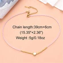 1條女性用精緻時尚的珊瑚粉色長頸鍊。它採用細金色鍊條,上面串著幾何多切割水晶珠,小心形吊飾和閃亮光澤。非常適合情人節、蜜月、度假或旅行等場合。 - 桃色 - 查看 3