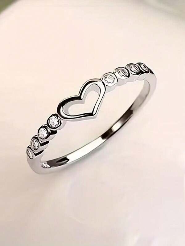 Anillo de plata de ley 925 en forma de corazón al estilo europeo y estadounidense para mujeres, ajustable, con corazón hueco decorado con cristales de imitación, accesorio de moda para el Día de San Valentín