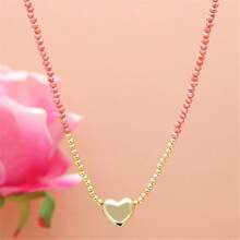 1條女性用精緻時尚的珊瑚粉色長頸鍊。它採用細金色鍊條,上面串著幾何多切割水晶珠,小心形吊飾和閃亮光澤。非常適合情人節、蜜月、度假或旅行等場合。 - 桃色 - 查看 7