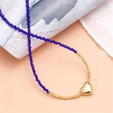 1條女性用精緻時尚的珊瑚粉色長頸鍊。它採用細金色鍊條,上面串著幾何多切割水晶珠,小心形吊飾和閃亮光澤。非常適合情人節、蜜月、度假或旅行等場合。 - 桃色 - 查看 6