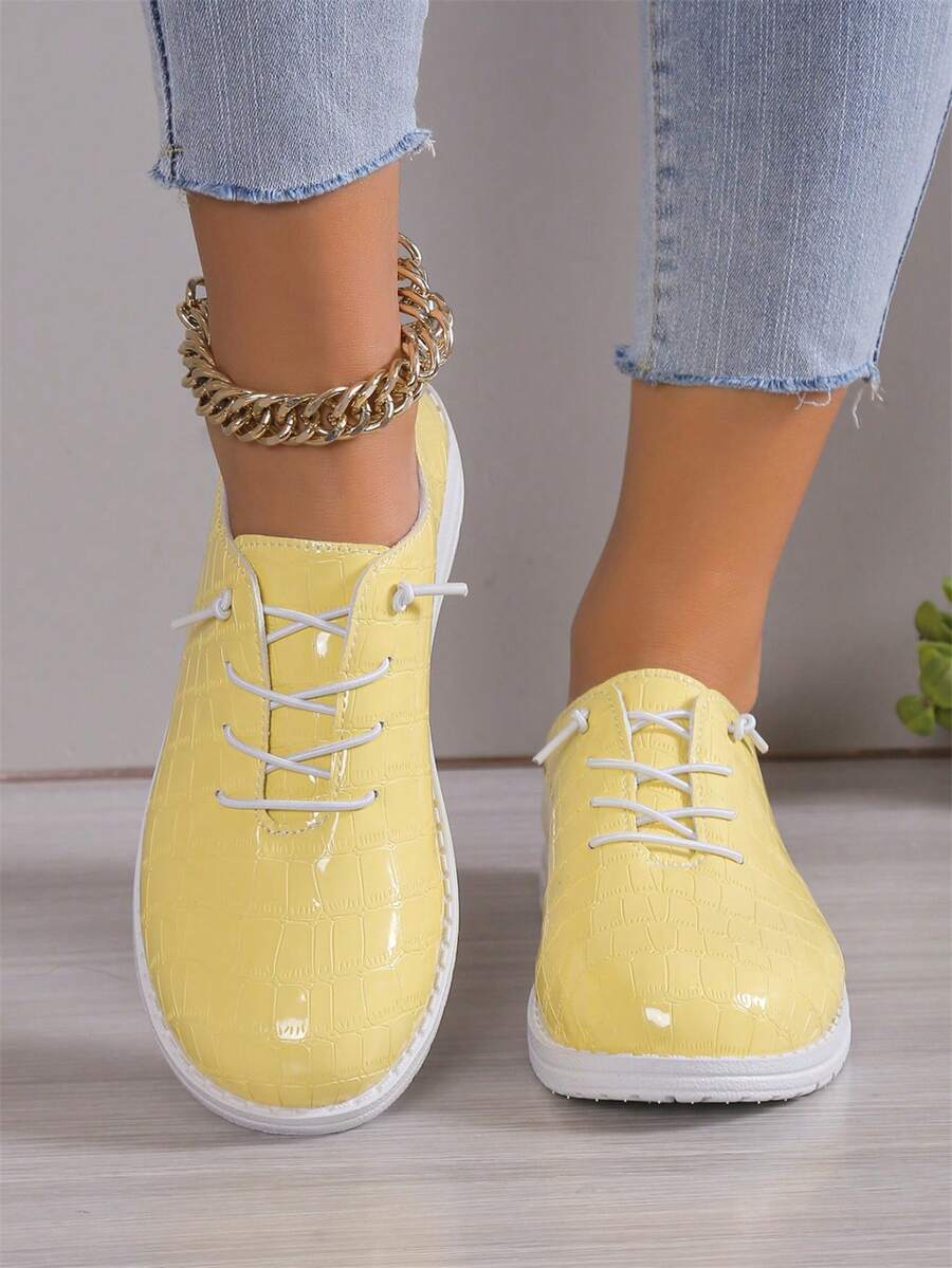 2024年流行的輕便休閒鞋,具有純色皮革設計 - 黃色 - 查看 1