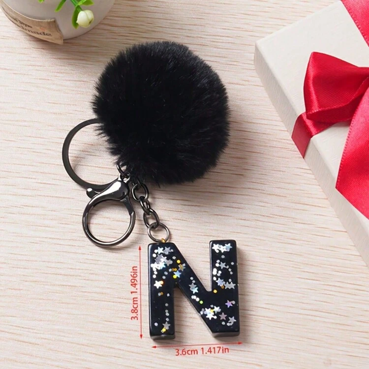 1 pieza Llavero con inicial de alfabeto, llavero de pompón de peluche lindo, llavero de resina con lentejuelas brillantes, colgante para bolsa, mochila, coche, accesorios para billetera y bolso, llavero con borlas, llavero de peluche con inicial de alfabeto A-Y - Negro - Añade 23
