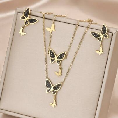 Set de 4 piezas de joyería con tono dorado de acero inoxidable, color negro mate con diseño de mariposa, incluyendo collar, pulsera y aretes, estilo minimalista y vintage, para uso casual, de fiesta y días festivos, unisex