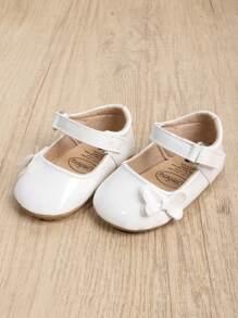 1 coppia Scarpe PU per bambine, con nodo a fiocco di colore solido, chiusura a gancio e anello, suola morbida antiscivolo adatta per bambini da 0-18 mesi, stile principessa elegante e atmosferico, perfetto per la stagione primavera e autunno