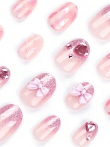 24入組短圓形指甲貼,配有粉色3d蝴蝶結和心形鑽石裝飾、粉色閃爍和漸變貼紙。每套附帶果凍膠1pc、指甲文件1pc。適用於派對、舞蹈或日常穿著,讓你的風格更上一層樓。 - 彩色 - 查看 3