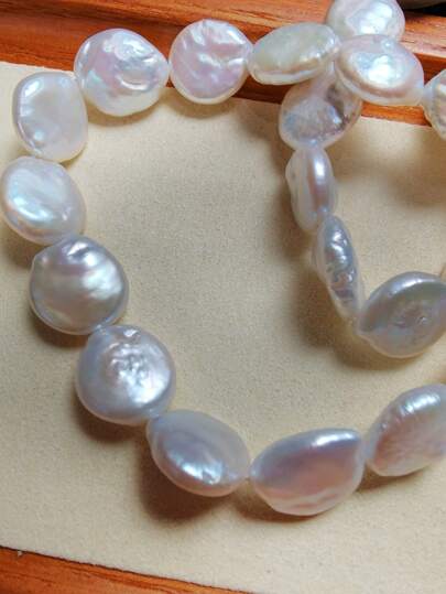 1 chuỗi hạt ngọc trai nước ngọt nuôi cấy màu trắng, dài 38cm, kích thước 11-12mm, thích hợp để làm vòng cổ hoặc vòng tay.
