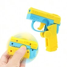 Carrot Gun Mini Rotating Action Toy, Decocker Finger Spinner Gun 2-In-1 Toy. Can Be Used As Finger Spinner Or Mini Pistol. Press To Automatically Recock With Random Color - Yellow - View 2