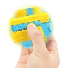 Carrot Gun Mini Rotating Action Toy, Decocker Finger Spinner Gun 2-In-1 Toy. Can Be Used As Finger Spinner Or Mini Pistol. Press To Automatically Recock With Random Color - Yellow - View 5