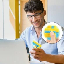 Carrot Gun Mini Rotating Action Toy, Decocker Finger Spinner Gun 2-In-1 Toy. Can Be Used As Finger Spinner Or Mini Pistol. Press To Automatically Recock With Random Color - Yellow - View 8