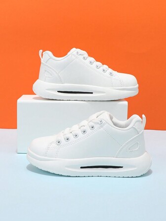 Zapatillas casual unisex para niños blancas de corte bajo con banda elástica, zapatos sin cordones para el campus, cómodos y livianos