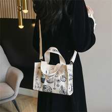 1個塗鴉藝術帆布袋,2024四季簡約休閑斜挎手提袋,百搭時尚日常通勤手提包,富有藝術感的學校用品,適合女性日常外出、通勤和上學使用。 - 白色 - 查看 3