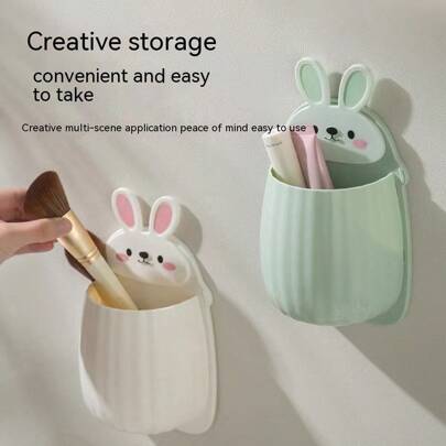 1个壁挂式兔子造型收纳架，可用于存放牙刷、沥水和多功能浴室收纳，无需钻孔