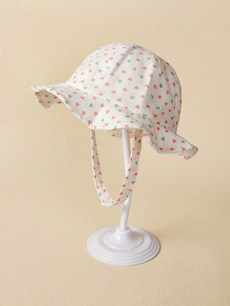 TUTUYA Infant Bucket Hat With Soft Brim, Baby Girl Sun Protection Hat, All Season Comfortable & Cute Heart Print Sun Hat With Chin Strap, Suitable For Daily/Outdoor/Play, Fits Head Circumference 44-50CM, 0-36 Months - White - View 1