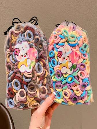 200 pzas/bolsa Conjunto de accesorios para el cabello de niños con bandas elásticas de goma de colores mezclados, diseños de dibujos animados lindos para niñas, solo se muestra la bolsa de empaque, bolsa de OPP