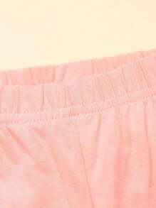 Conjunto de top de manga corta con dobladillo de encaje rosa y pantalón largo