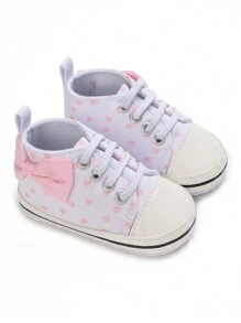 女童心型和蝴蝶結設計防滑帆布平底鞋，適合所有季節