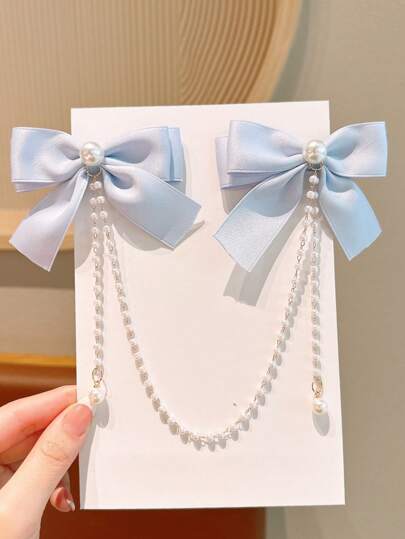 1pc Teen Girl Fashionable Cute Pearl Bow Pearl Tassel Hair Clip Accessories. Please Note That Slight Color Variation May Exist Due To Different Fabric Batches, And The Packaging Card And Actual Item Take Precedence. The Number Of Pearls Is Random.