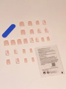 Augmentez votre élégance avec un ensemble manucure de 24 pièces de forme cercueil courte. Ensemble d'ongles à clipser simples et doux avec motif floral peint, convenant aux filles pour le printemps. Fournitures d'ongles à clipser