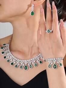 4 pièces/set bijoux de luxe à la mode avec zircone cubique AAA, parures avec pendentifs style goutte d'eau comprenant collier, bracelet, boucles d'oreilles, bague. Convient pour la décoration des fêtes et mariages des femmes. Cadeau parfait de la Saint-Valentin pour votre petite amie. Ensemble de bijoux haut de gamme.