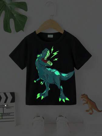 Camiseta de manga corta con cuello redondo y estampado de dinosaurios en relieve y que brilla en la oscuridad muy de moda para niño joven, primavera/verano