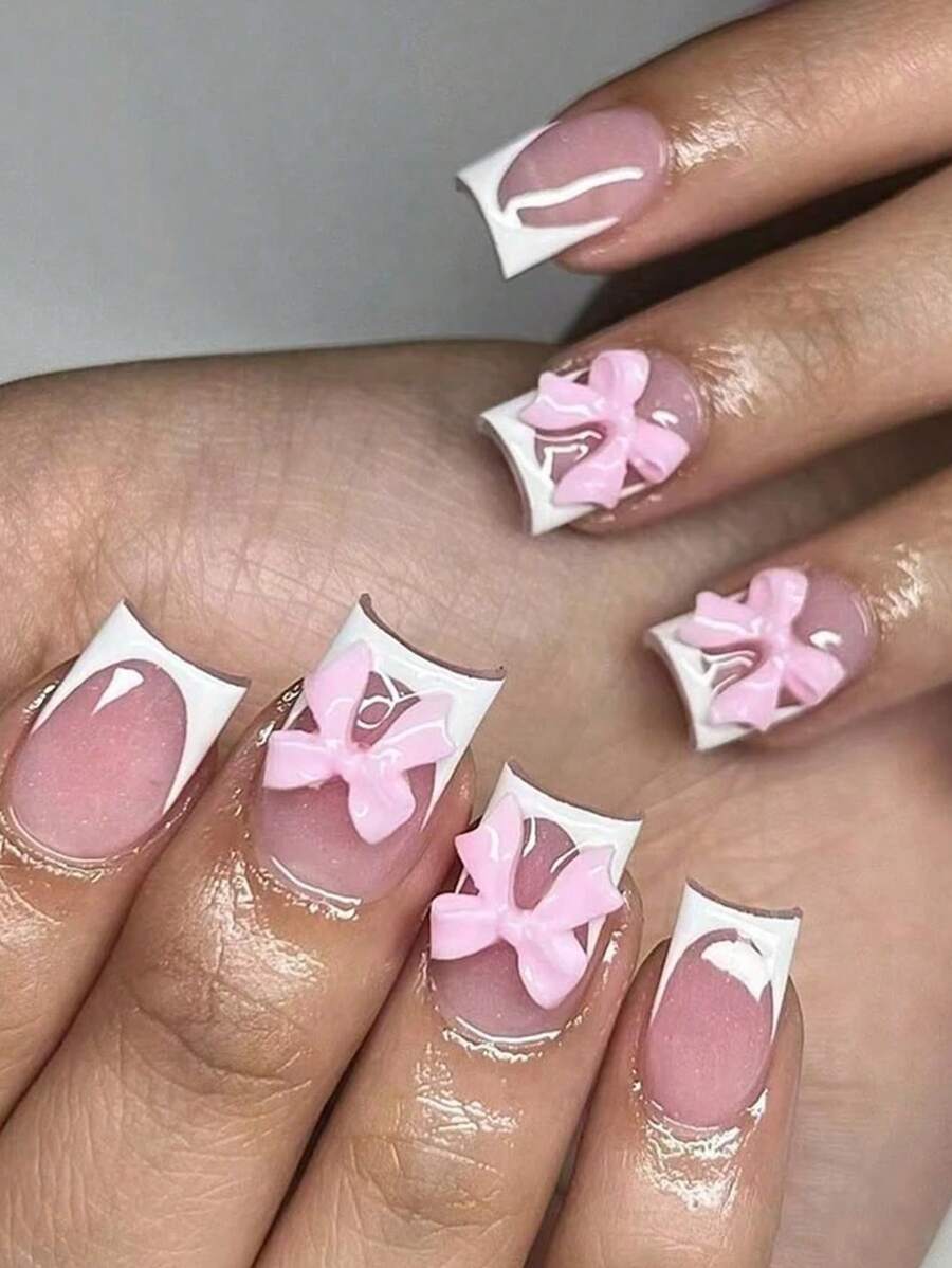 使用24入組短方形法式粉色蝴蝶結設計假指甲，讓您更加迷人。適用於派對、約會、跳舞和日常穿著。壓縮式指甲美容用品 - 彩色 - 查看 1