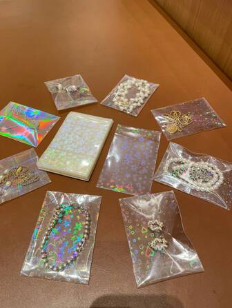 50/100pcs Transparent Holographic Iridescent Jewelry Bags, Jewelry Protection Bags Heart Gradient Transparent OPP Bags, Shiny Card Film, Colorful Photochromic Photo Card Protector