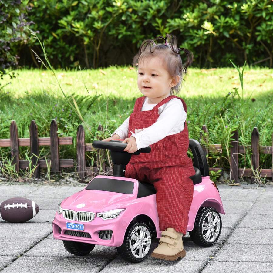HOMCOM Macchinina per Bambini Cavalcabile con Volante, Fari e Musiche Integrate, Età 18-36 Mesi, 63.5x28x36cm, Rosa