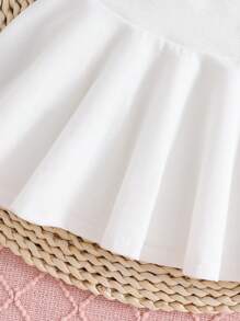 Young Girl Solid Colored Vest And Skirt Set