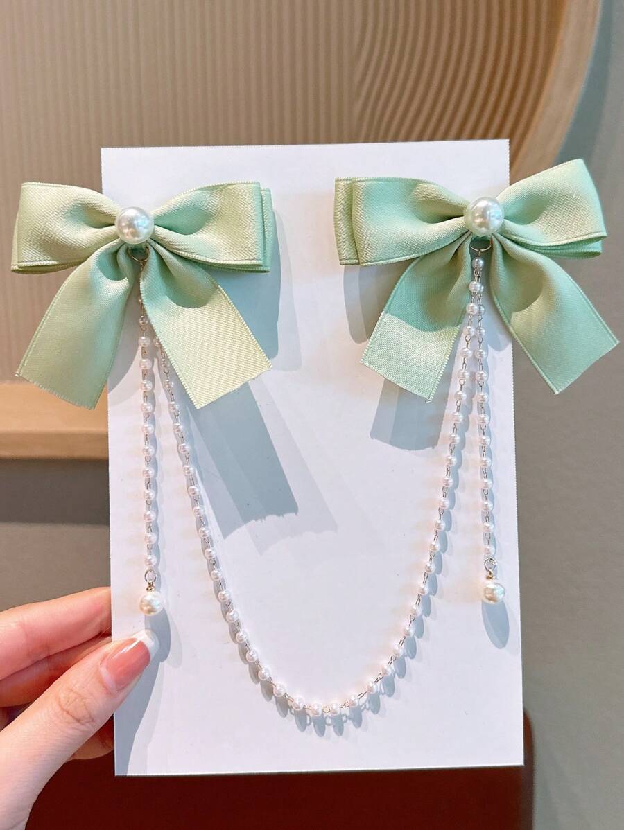 1 件女孩时尚可爱珍珠蝴蝶结流苏发夹。由于面料批次不同，略有色差属正常现象，以包装卡和实际产品为准。珠子数量随机。 - 薄荷綠 - 查看 1
