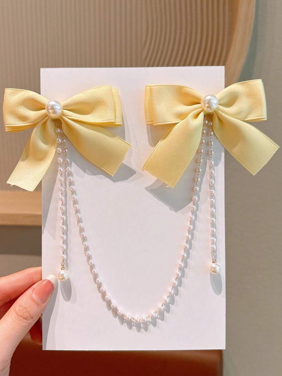 1 件女孩时尚可爱珍珠蝴蝶结丝带珍珠流苏发夹。因材料批次而略有色差属正常现象，以包装卡和实际物品为准。珍珠数量随机。 - 黃色 - 查看 1