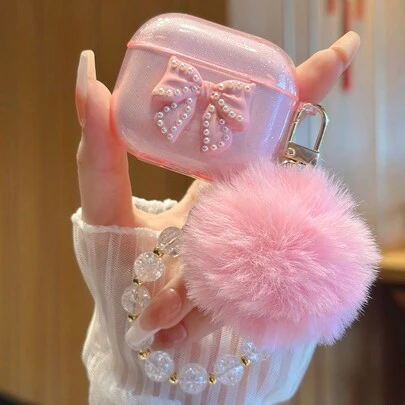 苹果美学粉色蝴蝶结耳机盒饰有仿珍珠、蝴蝶结和毛绒球饰链