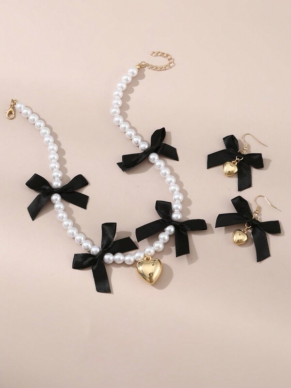 Set de 3 piezas de collar y aretes con perlas, corazón y lazo para niñas